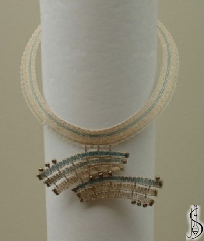 Necklace No. 10433c 
		   Blue and beige silk, golden metallic yarn supplemented by gold beads.

 ............................
 Protected by copyright! 




